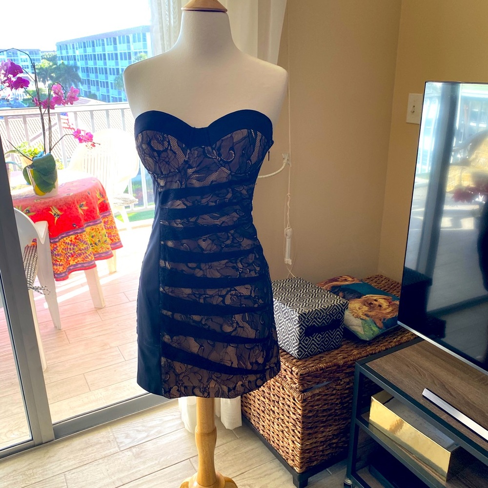 Bebe lace strapless dress with boning corset in the back and front!